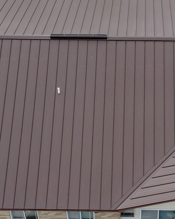 Standing seam metal roofing, bronze