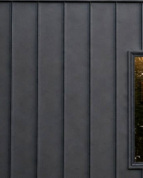 Standing seam metal siding, charcoal, on a Bison Pod